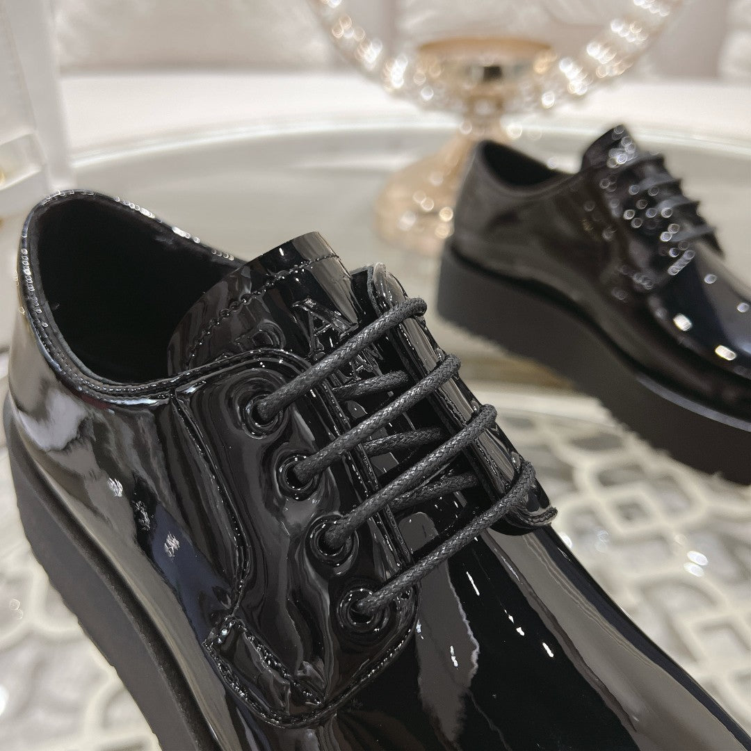PRADA 26S LOAFERS IN BLACK PATENT CALFSKIN