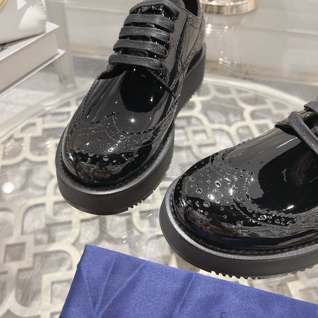 PRADA 26S BROGUE SHOES IN BLACK PATENT CALFSKIN
