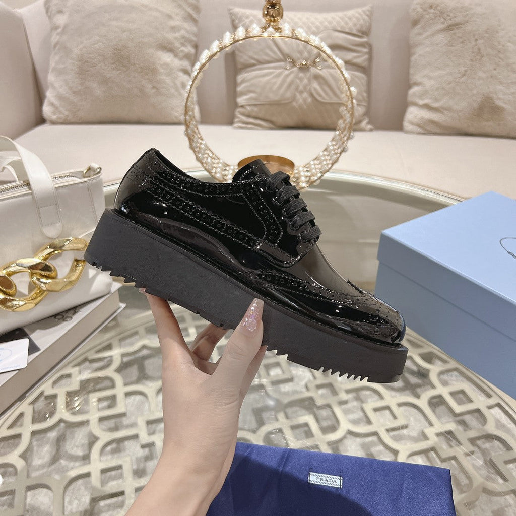 PRADA 26S BROGUE SHOES IN BLACK PATENT CALFSKIN