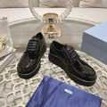 PRADA 26S BROGUE SHOES IN BLACK PATENT CALFSKIN