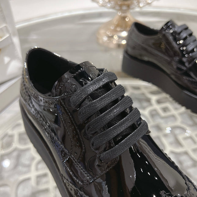 PRADA 26S BROGUE SHOES IN BLACK PATENT CALFSKIN