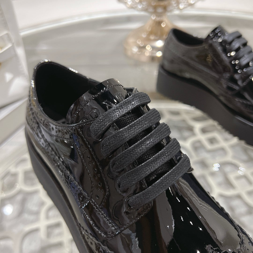 PRADA 26S BROGUE SHOES IN BLACK PATENT CALFSKIN