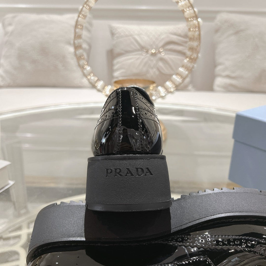 PRADA 26S BROGUE SHOES IN BLACK PATENT CALFSKIN