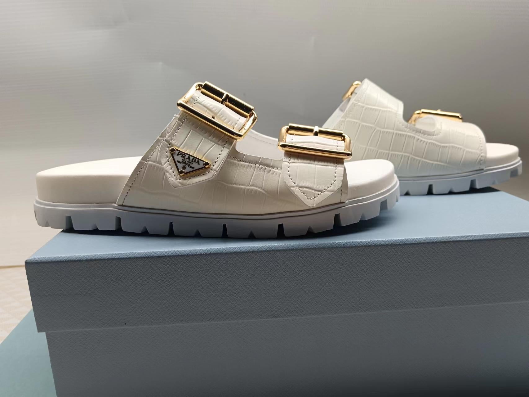 PRADA 26S STRAP SLIDES IN IVORY WHITE CROC EMBOSSED CALFSKIN GOLD HARDWARE