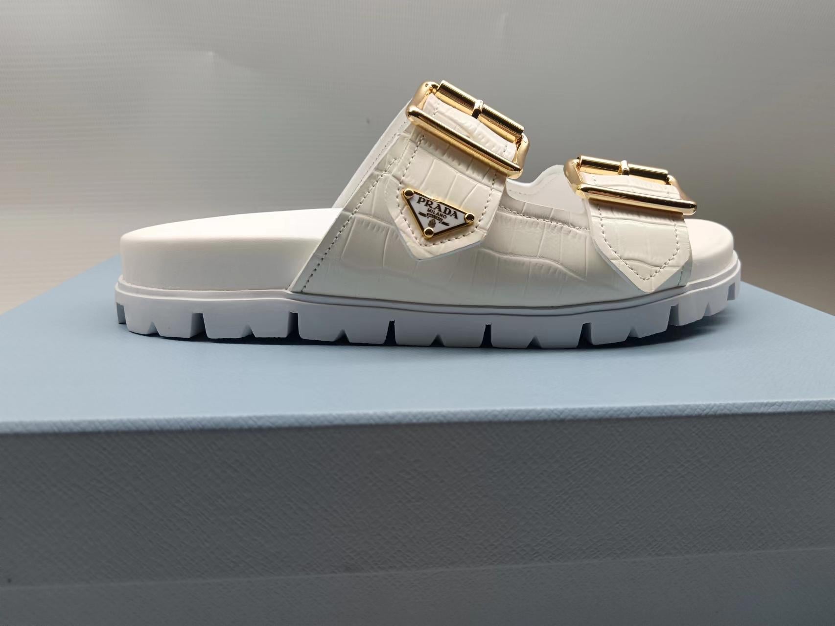 PRADA 26S STRAP SLIDES IN IVORY WHITE CROC EMBOSSED CALFSKIN GOLD HARDWARE