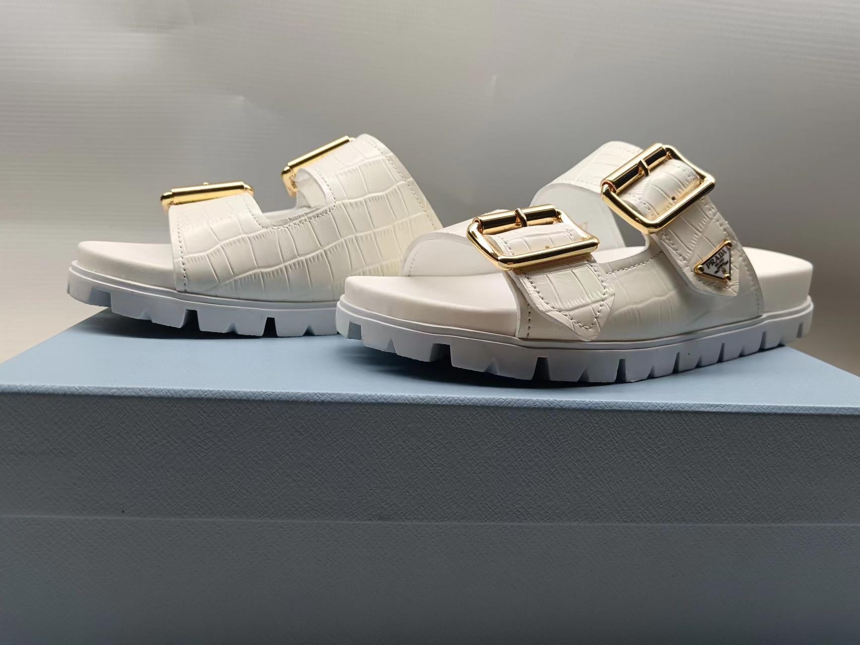 PRADA 26S STRAP SLIDES IN IVORY WHITE CROC EMBOSSED CALFSKIN GOLD HARDWARE
