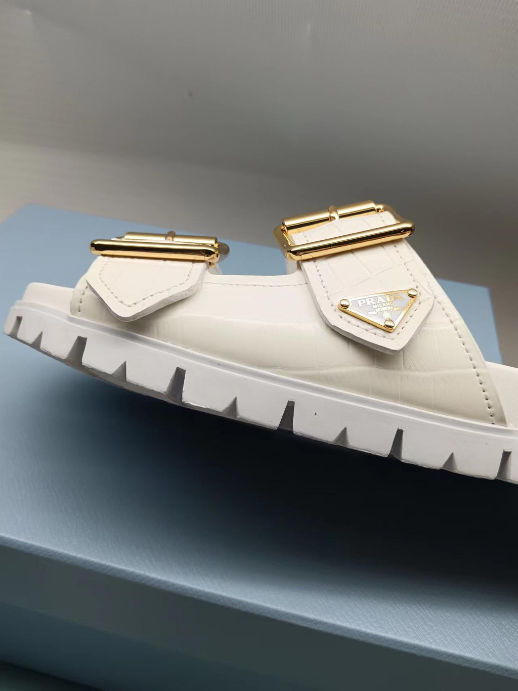 PRADA 26S STRAP SLIDES IN IVORY WHITE CROC EMBOSSED CALFSKIN GOLD HARDWARE