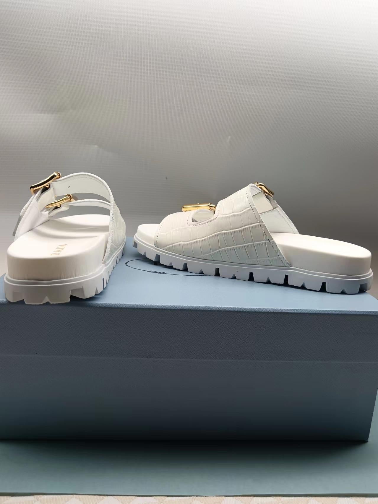 PRADA 26S STRAP SLIDES IN IVORY WHITE CROC EMBOSSED CALFSKIN GOLD HARDWARE