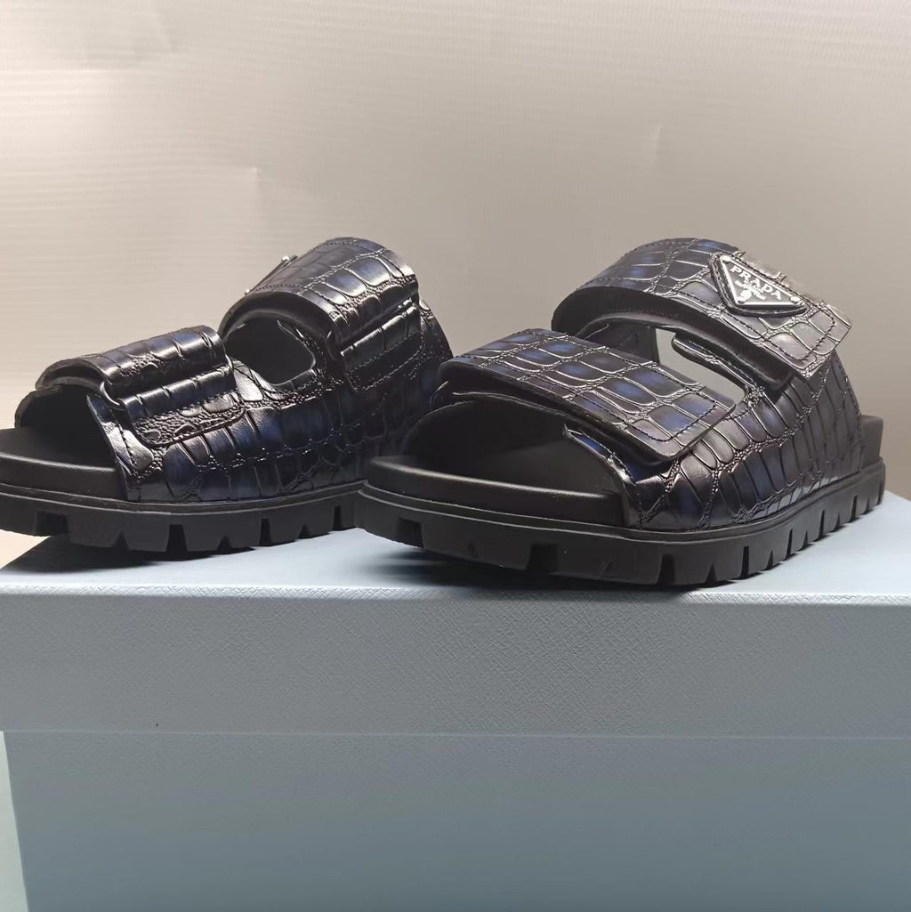 PRADA 26S STRAP SLIDES IN BLACK CROC EMBOSSED CALFSKIN