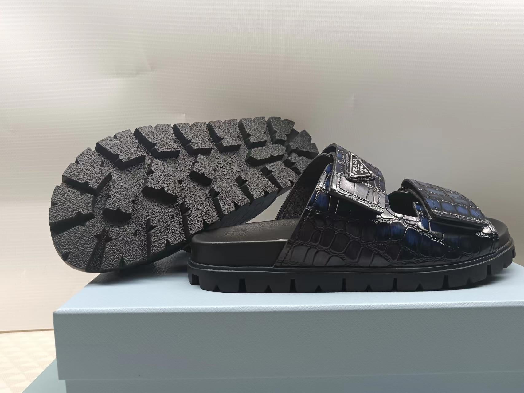 PRADA 26S STRAP SLIDES IN BLACK CROC EMBOSSED CALFSKIN