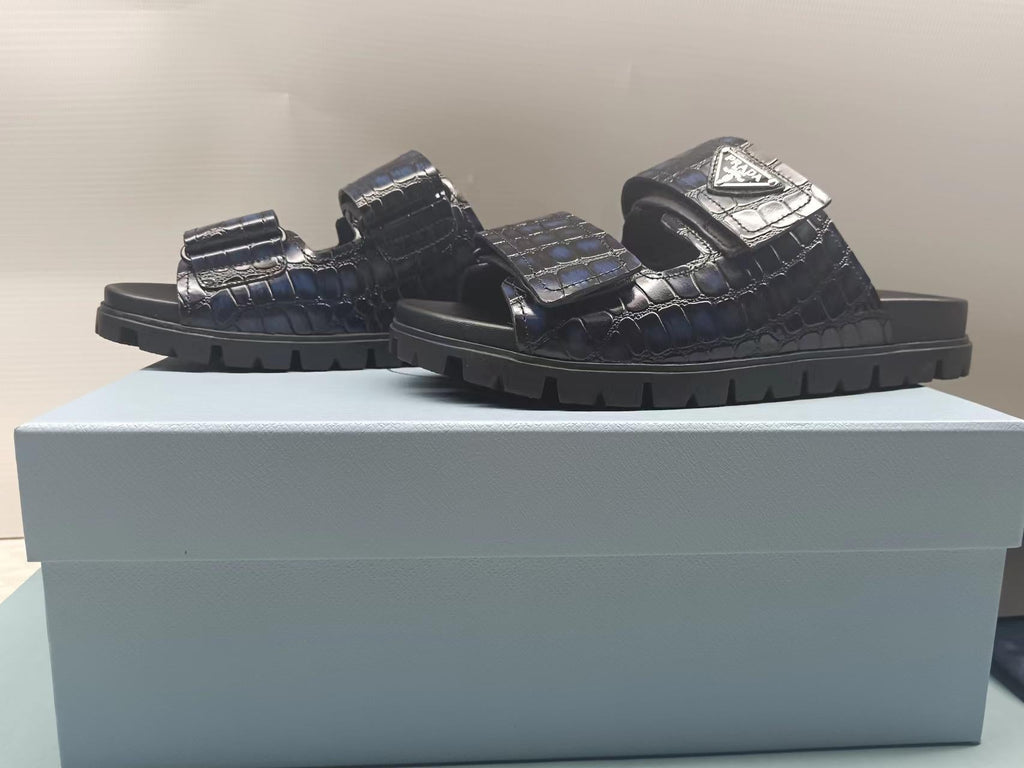 PRADA 26S STRAP SLIDES IN BLACK CROC EMBOSSED CALFSKIN