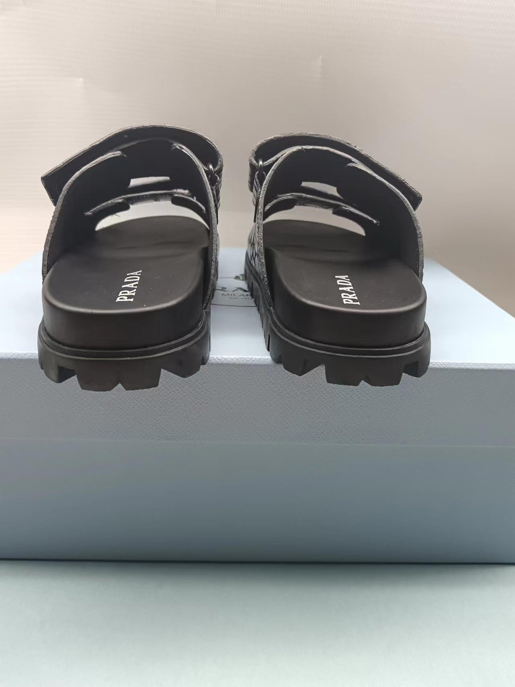 PRADA 26S STRAP SLIDES IN BLACK CROC EMBOSSED CALFSKIN