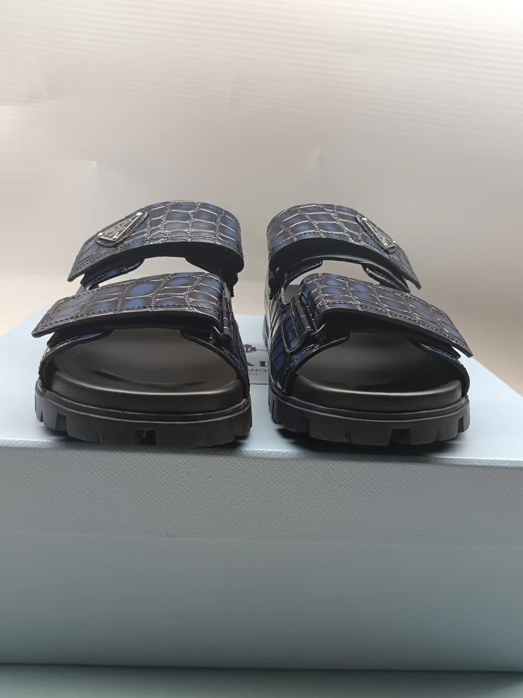 PRADA 26S STRAP SLIDES IN BLACK CROC EMBOSSED CALFSKIN