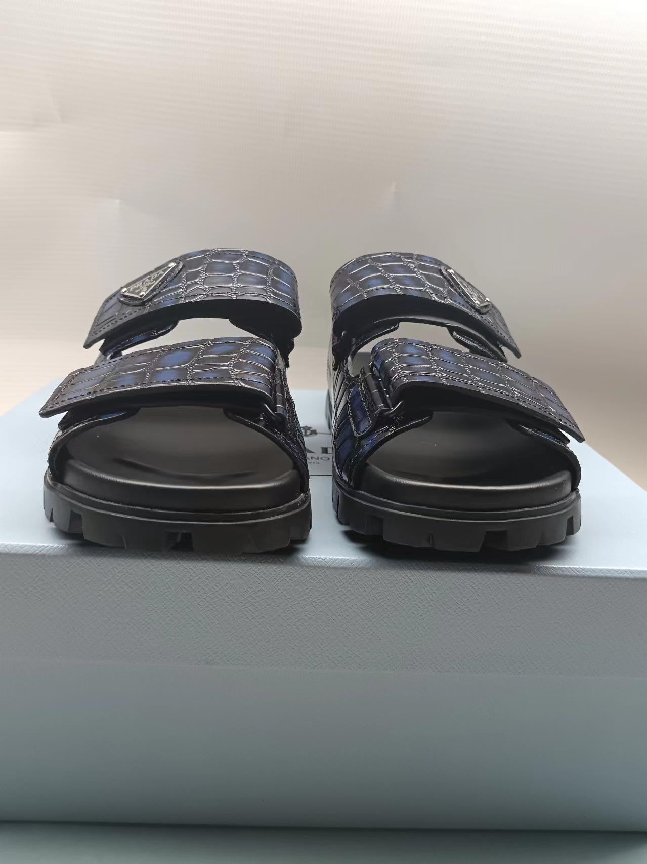 PRADA 26S STRAP SLIDES IN BLACK CROC EMBOSSED CALFSKIN