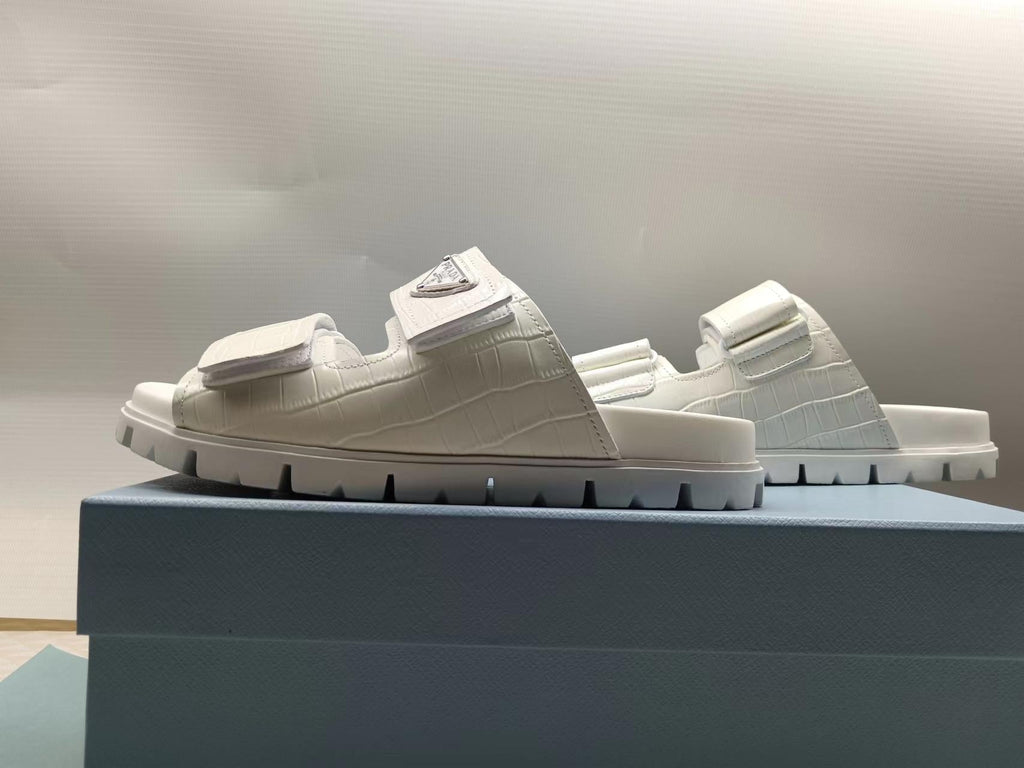 PRADA 26S STRAP SLIDES IN IVORY WHITE CROC EMBOSSED CALFSKIN
