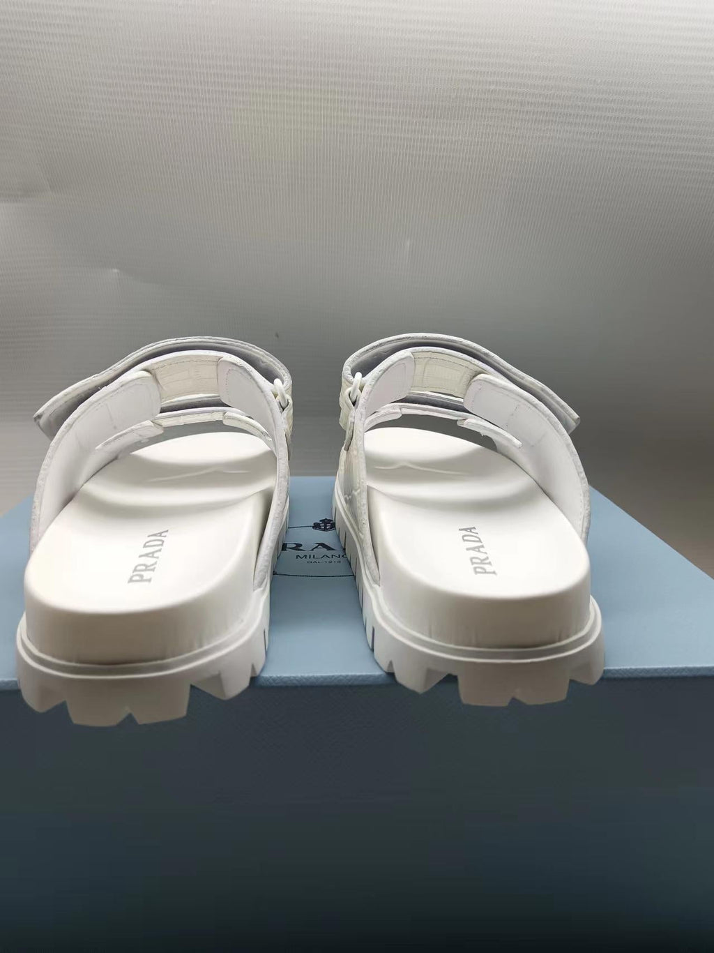 PRADA 26S STRAP SLIDES IN IVORY WHITE CROC EMBOSSED CALFSKIN