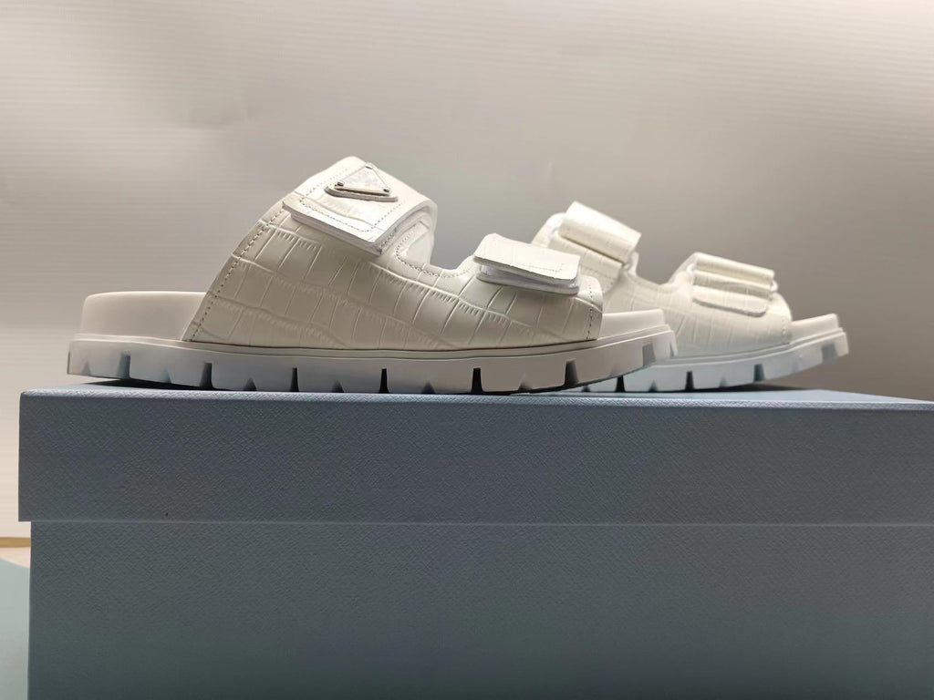 PRADA 26S STRAP SLIDES IN IVORY WHITE CROC EMBOSSED CALFSKIN