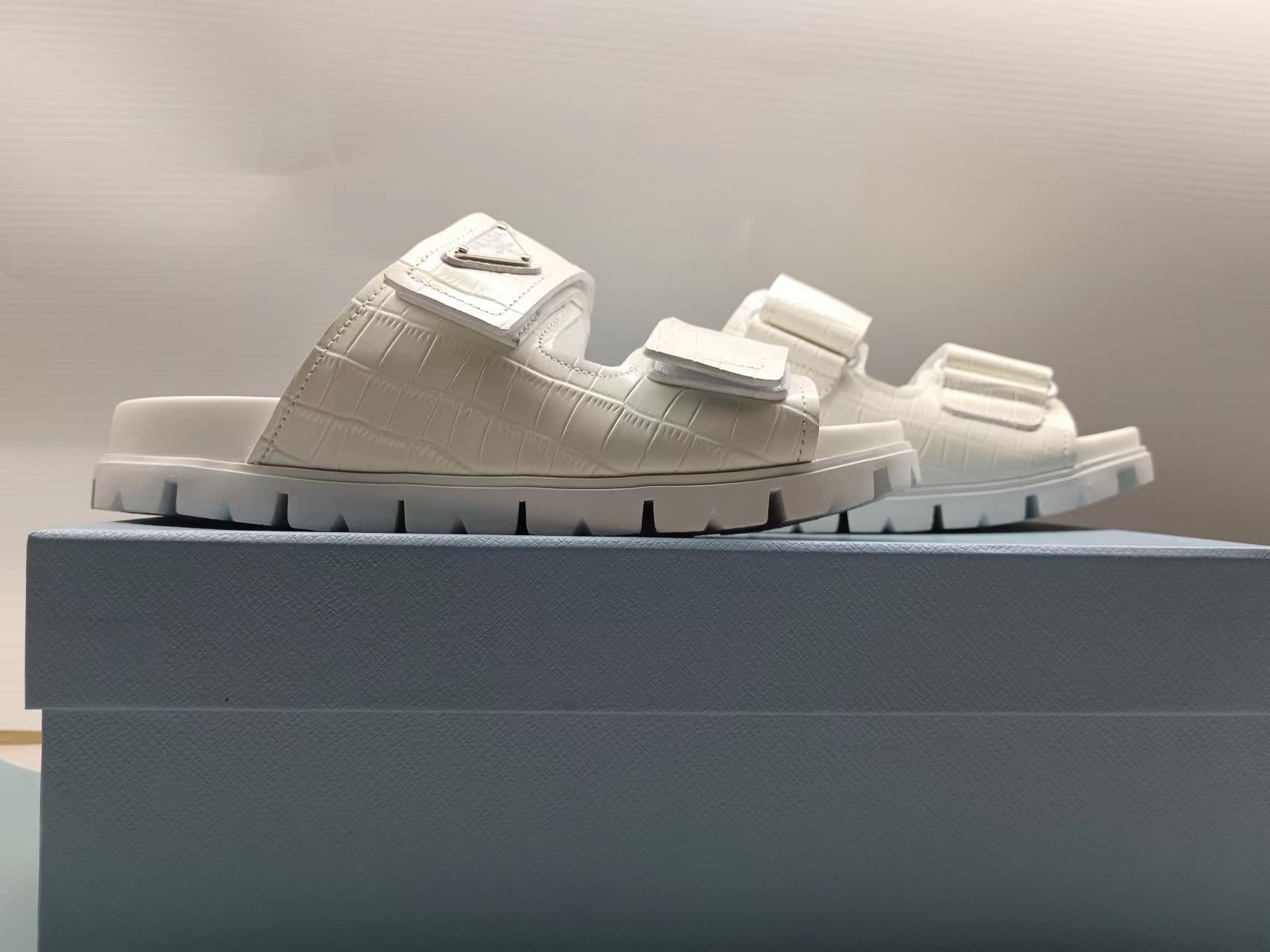 PRADA 26S STRAP SLIDES IN IVORY WHITE CROC EMBOSSED CALFSKIN