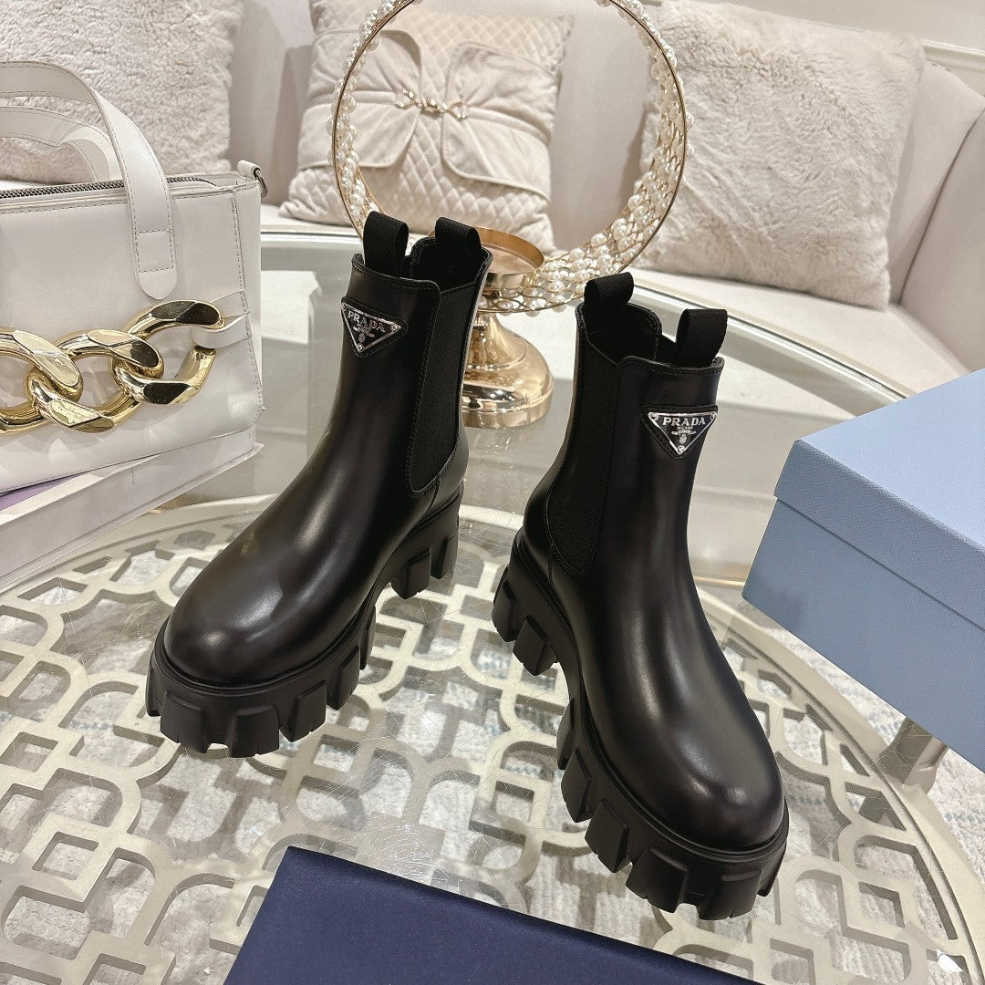 PRADA 26S MONOLITH CHELSEA BOOTS IN BLACK CALFSKIN AND FABRIC