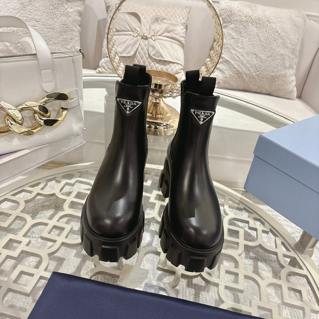 PRADA 26S MONOLITH CHELSEA BOOTS IN BLACK CALFSKIN AND FABRIC