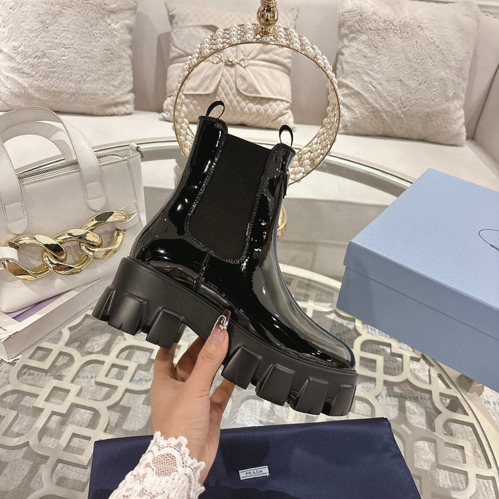 PRADA 26S MONOLITH CHELSEA BOOTS IN BLACK PATENT CALFSKIN AND FABRIC
