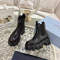 PRADA 26S MONOLITH CHELSEA BOOTS IN BLACK SHINY CALFSKIN AND FABRIC