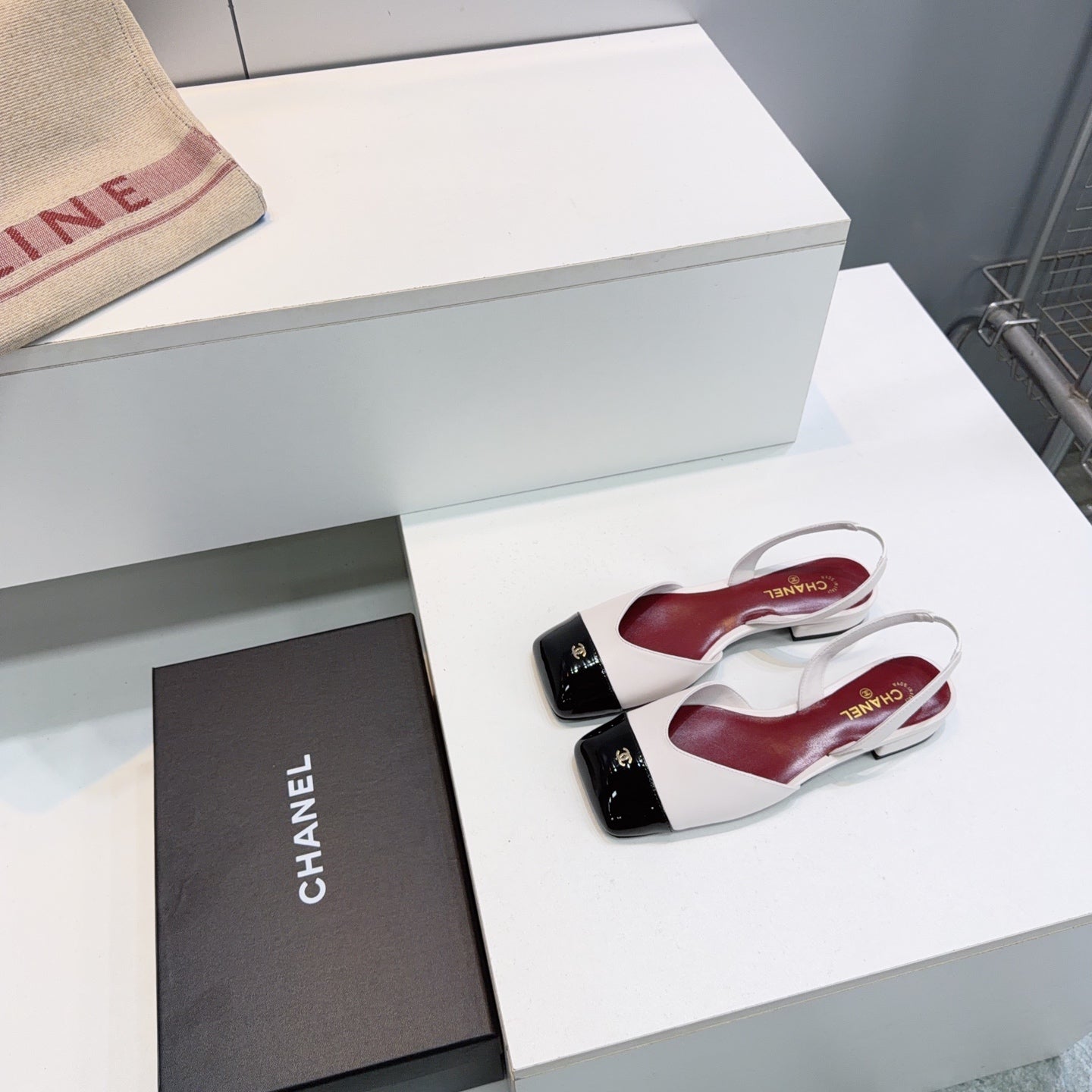 CHANEL 26S FLAT SLINGBACK IN WHITE LAMBSKIN WITH BLACK CAP TOE