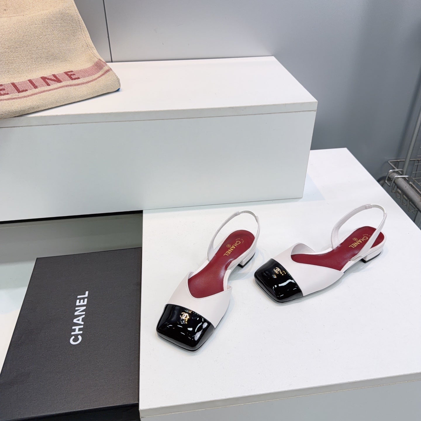 CHANEL 26S FLAT SLINGBACK IN WHITE LAMBSKIN WITH BLACK CAP TOE