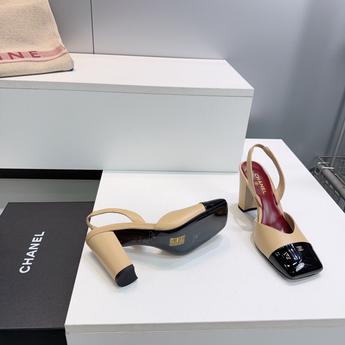 CHANEL 26S SLINGBACK 95 MM IN BEIGE LAMBSKIN WITH BLACK CAP TOE