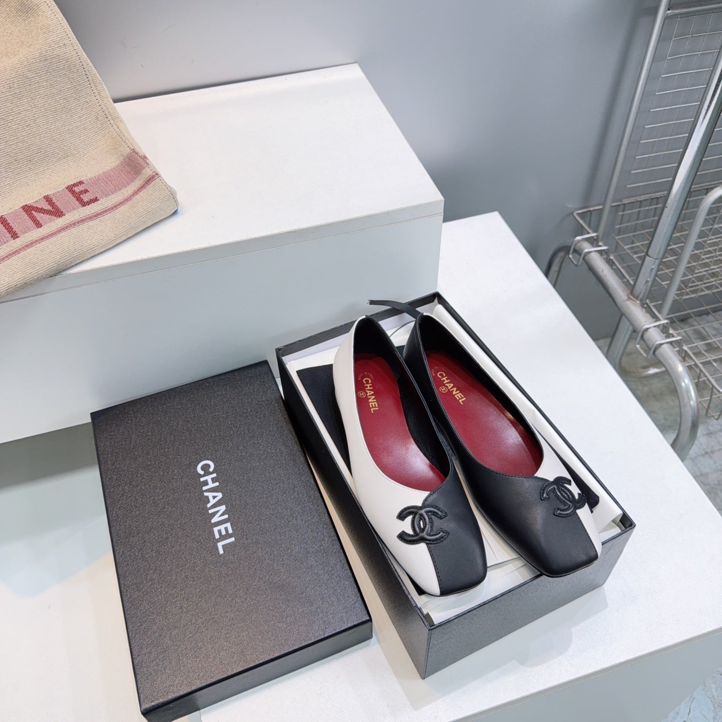 CHANEL 26S SQUARE-TOE FLATS IN BLACK AND WHITE LAMBSKIN