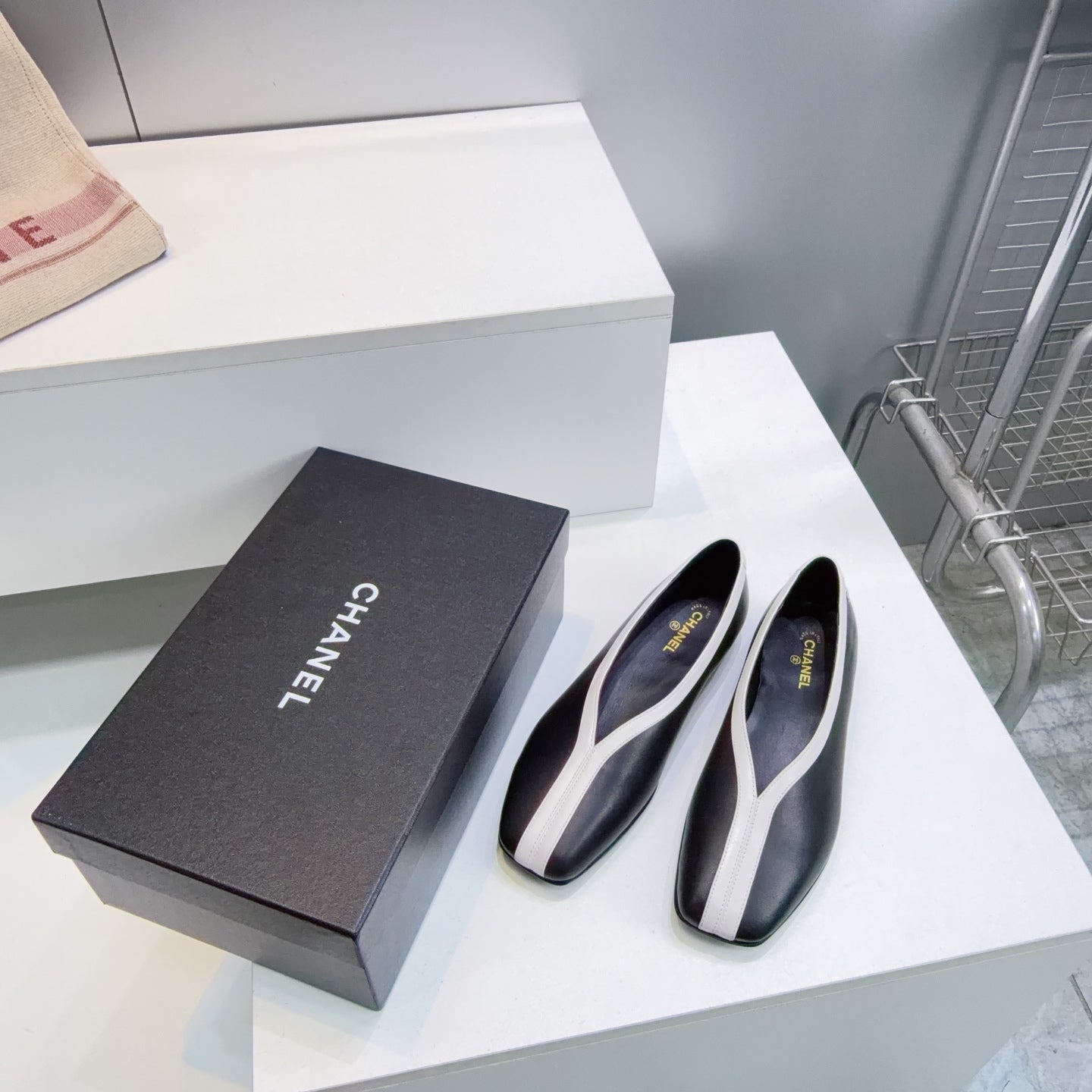 CHANEL 26S SQUARE-TOE FLATS IN BLACK LAMBSKIN WITH WHITE TRIM