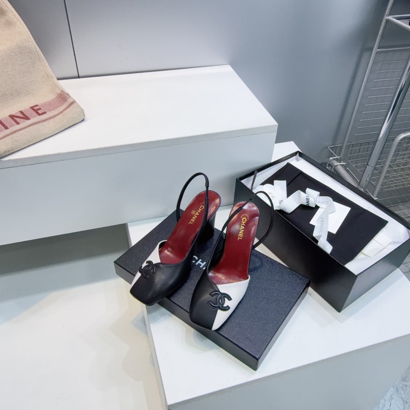 CHANEL 26S SLINGBACK 100 MM IN BLACK AND WHITE LAMBSKIN