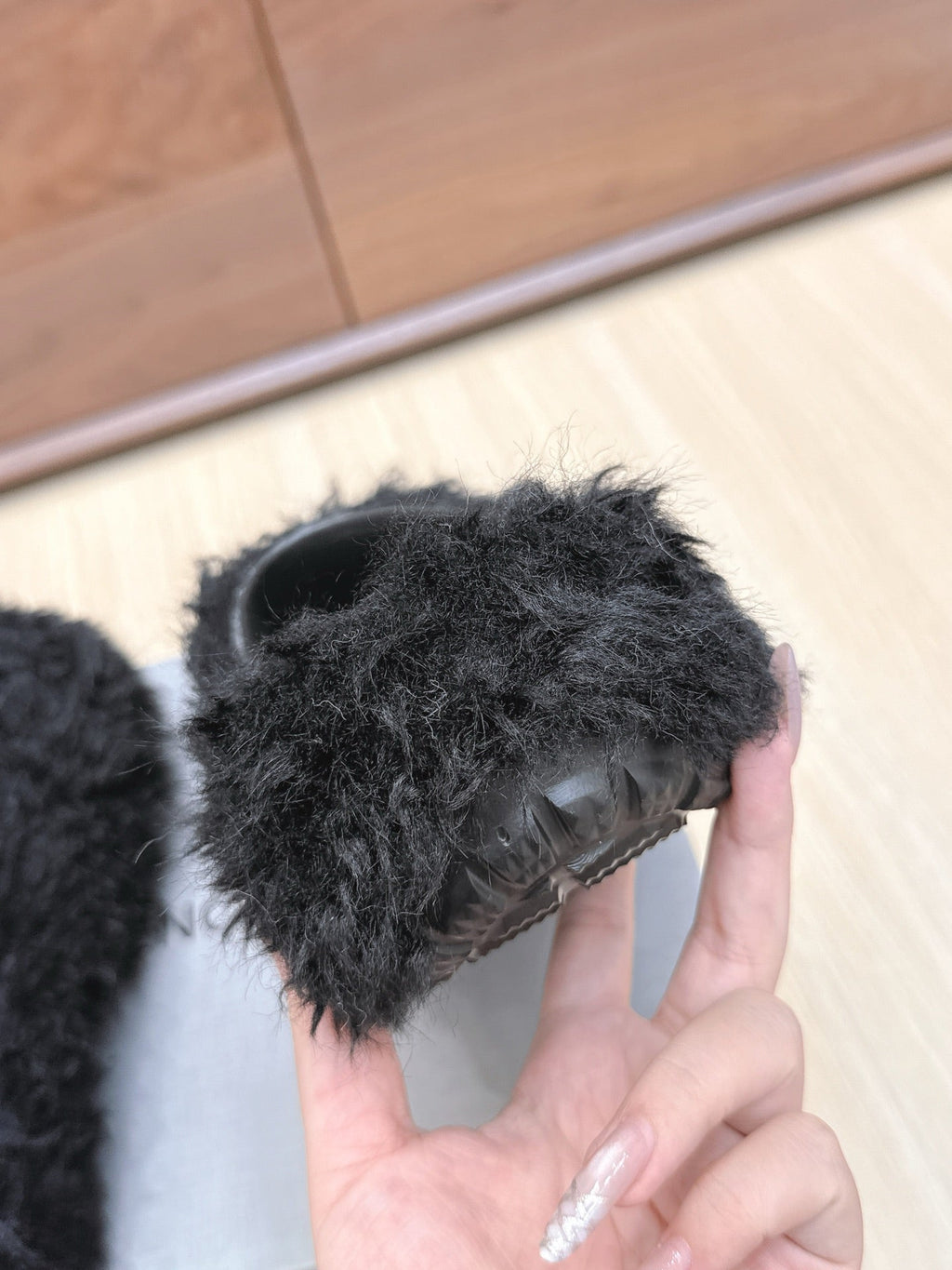 BALENCIAGA 25S MULES IN BLACK FAUX FUR