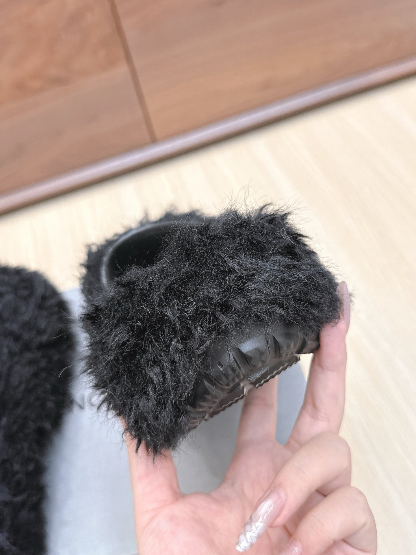 BALENCIAGA 25S MULES IN BLACK FAUX FUR