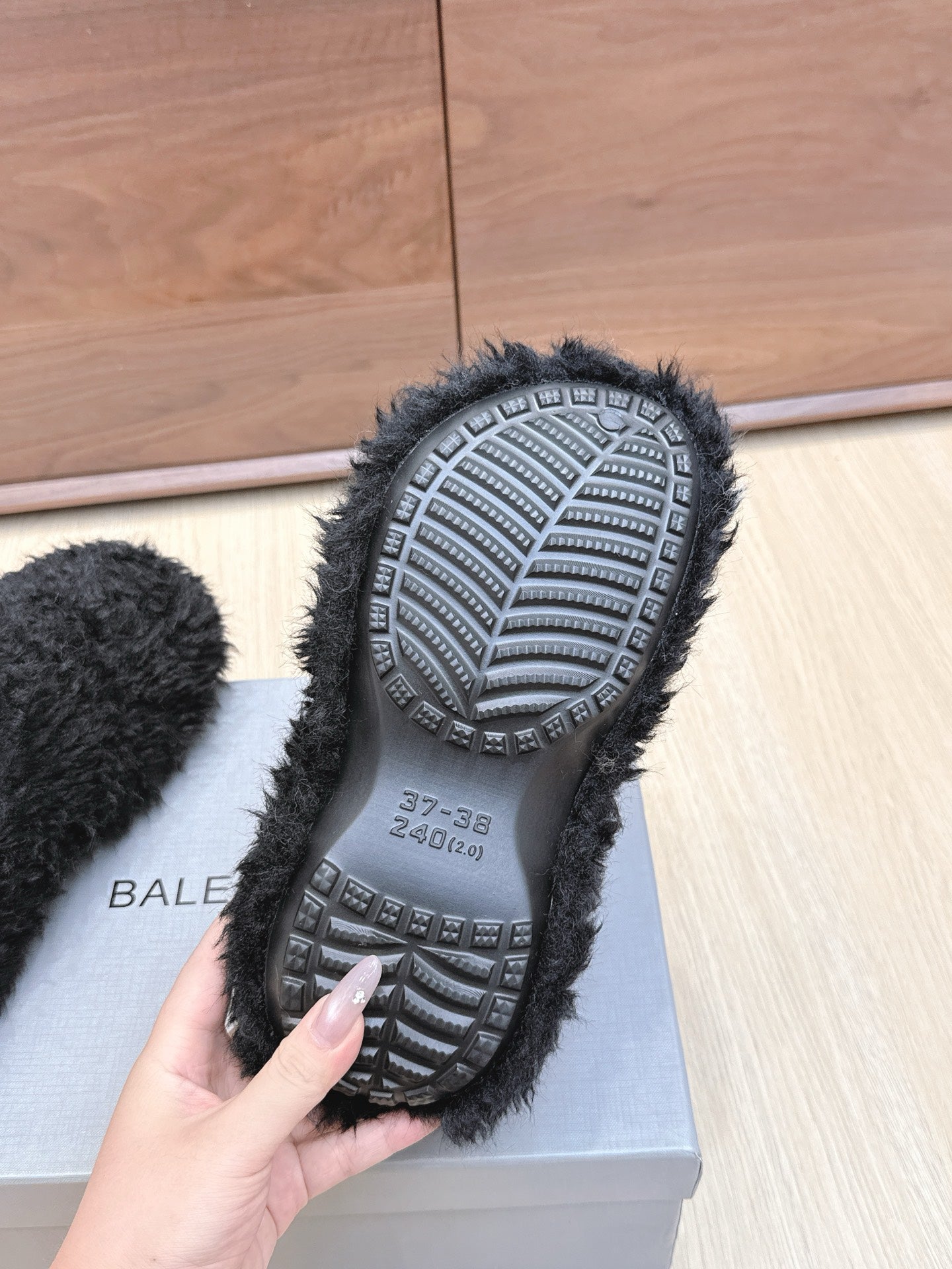 BALENCIAGA 25S MULES IN BLACK FAUX FUR