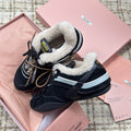 MIUMIU 26S SNEAKERS IN BLACK SUEDE AND SHEARLING