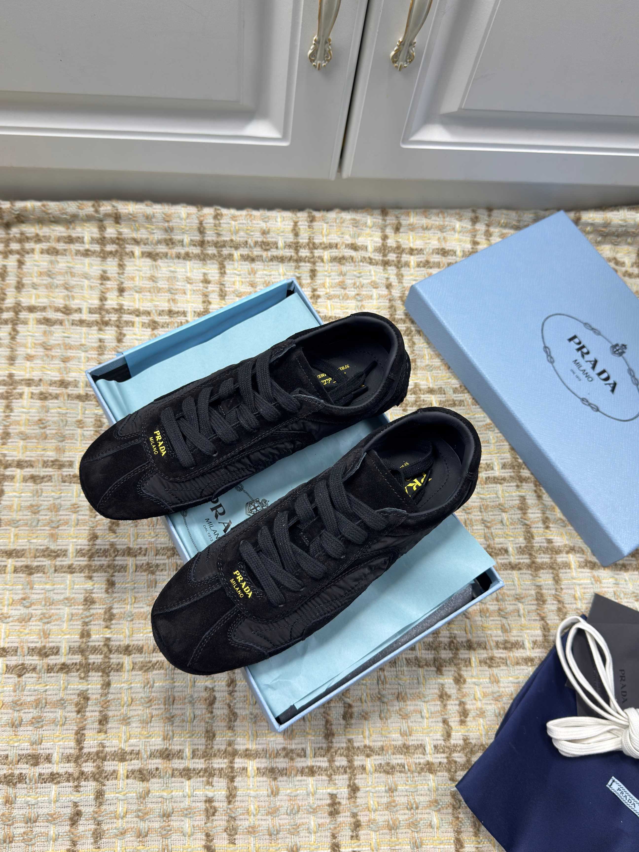 PRADA 26S LOW TOP SNEAKERS IN BLACK NYLON AND SUEDE