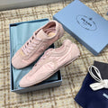 PRADA 26S LOW TOP SNEAKERS IN PINK NYLON AND SUEDE