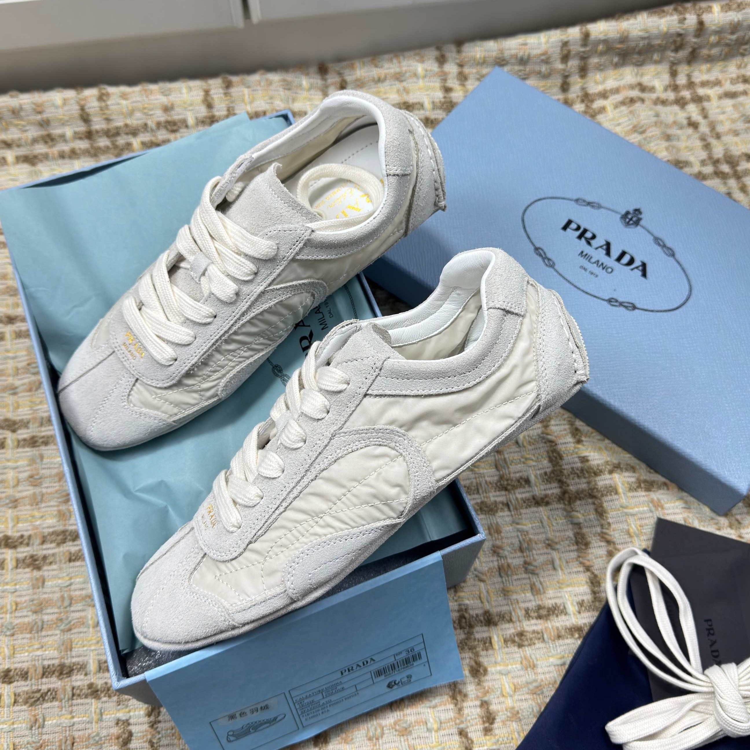 PRADA 26S LOW TOP SNEAKERS IN WHITE NYLON AND SUEDE