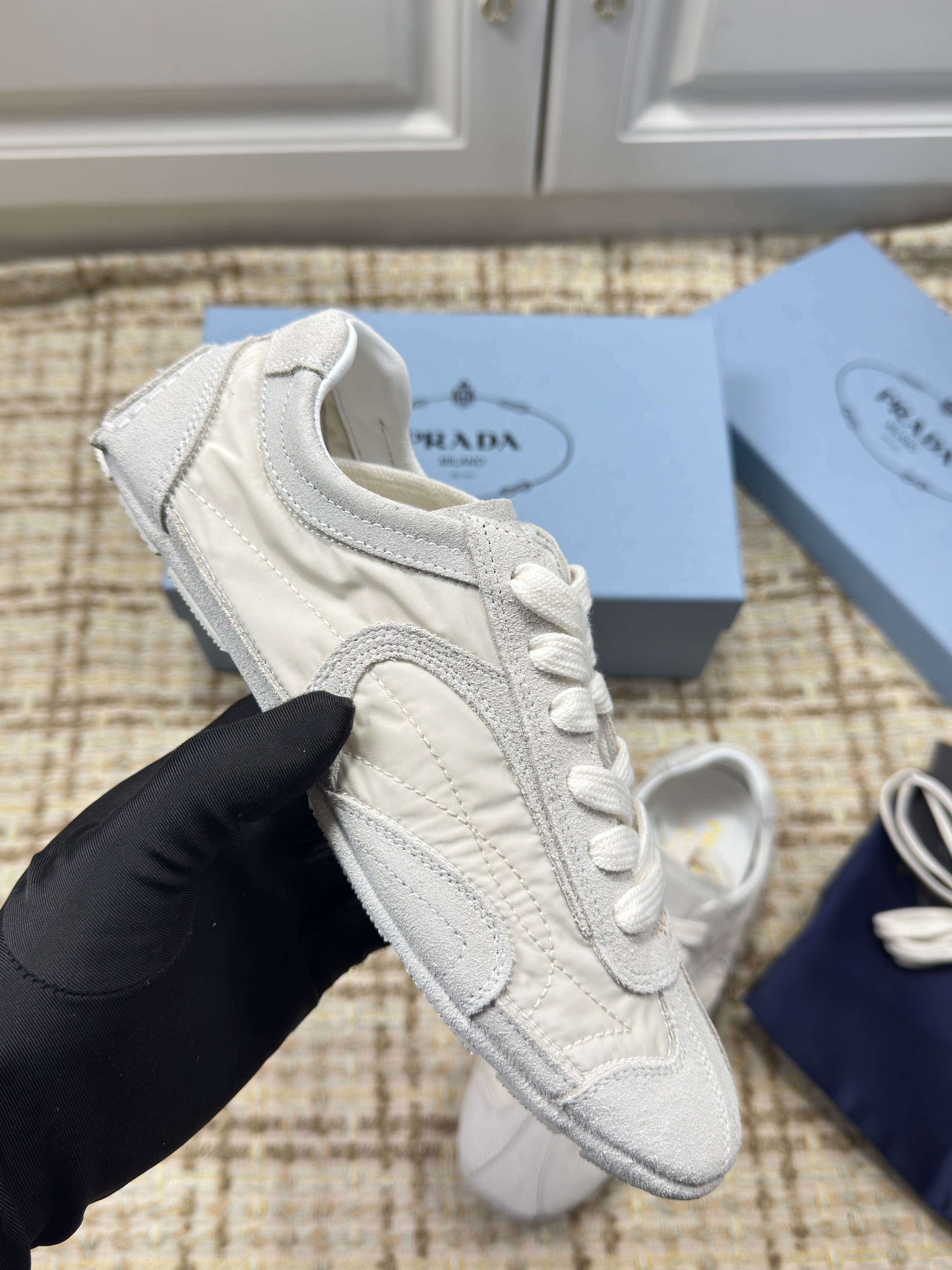 PRADA 26S LOW TOP SNEAKERS IN WHITE NYLON AND SUEDE