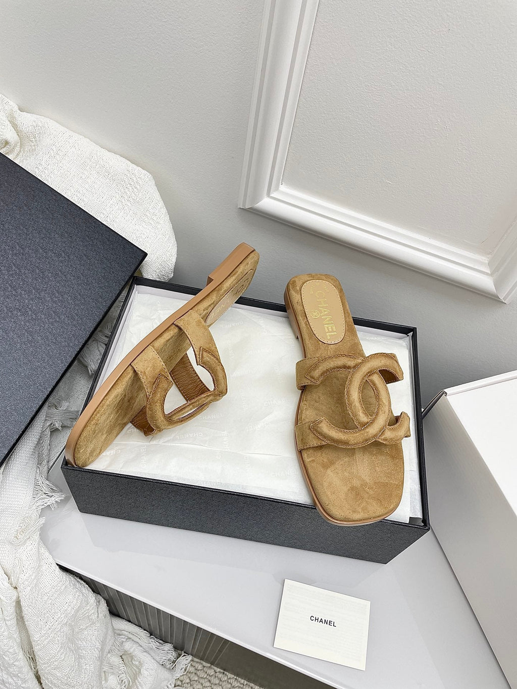 CHANEL CC LOGO MULES IN DARK BEIGE SUEDE
