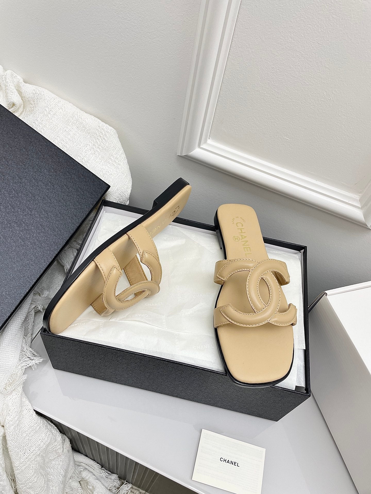 CHANEL CC LOGO MULES IN BEIGE CALFSKIN
