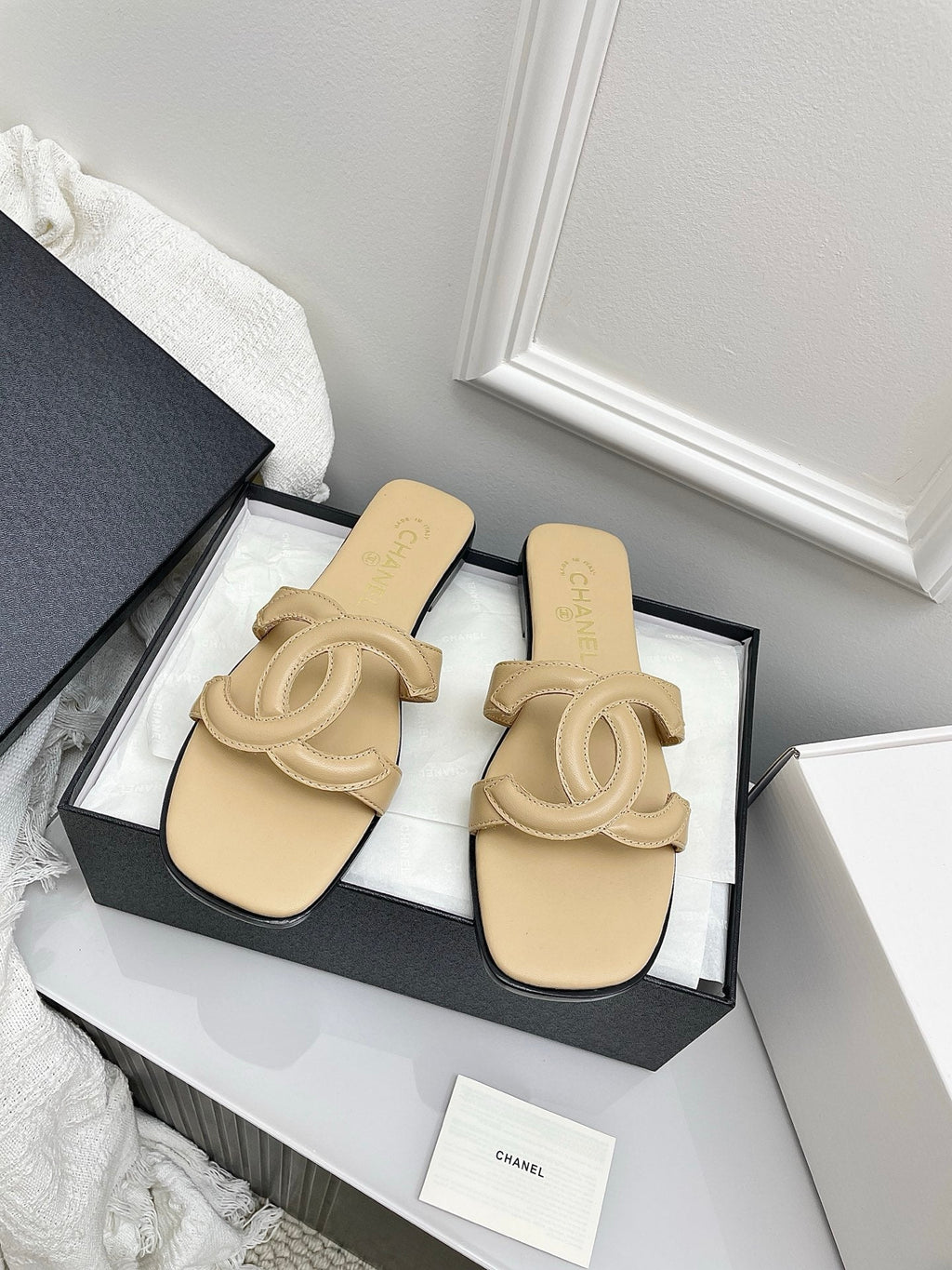 CHANEL CC LOGO MULES IN BEIGE CALFSKIN