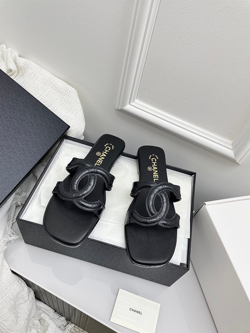CHANEL CC LOGO MULES IN BLACK CALFSKIN