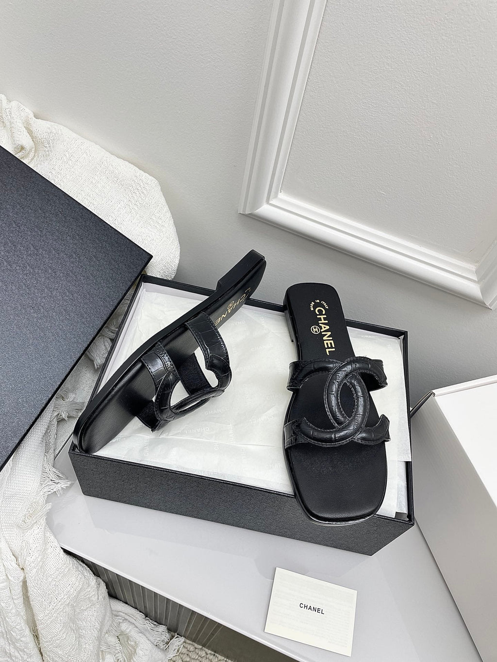 CHANEL CC LOGO MULES IN BLACK CALFSKIN