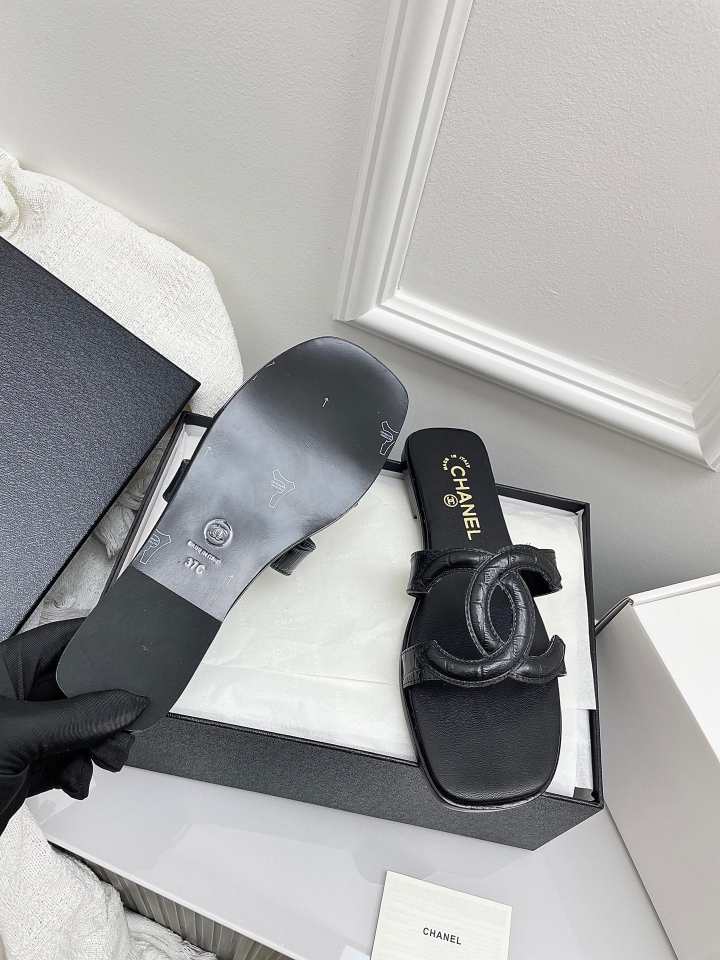CHANEL CC LOGO MULES IN BLACK CALFSKIN