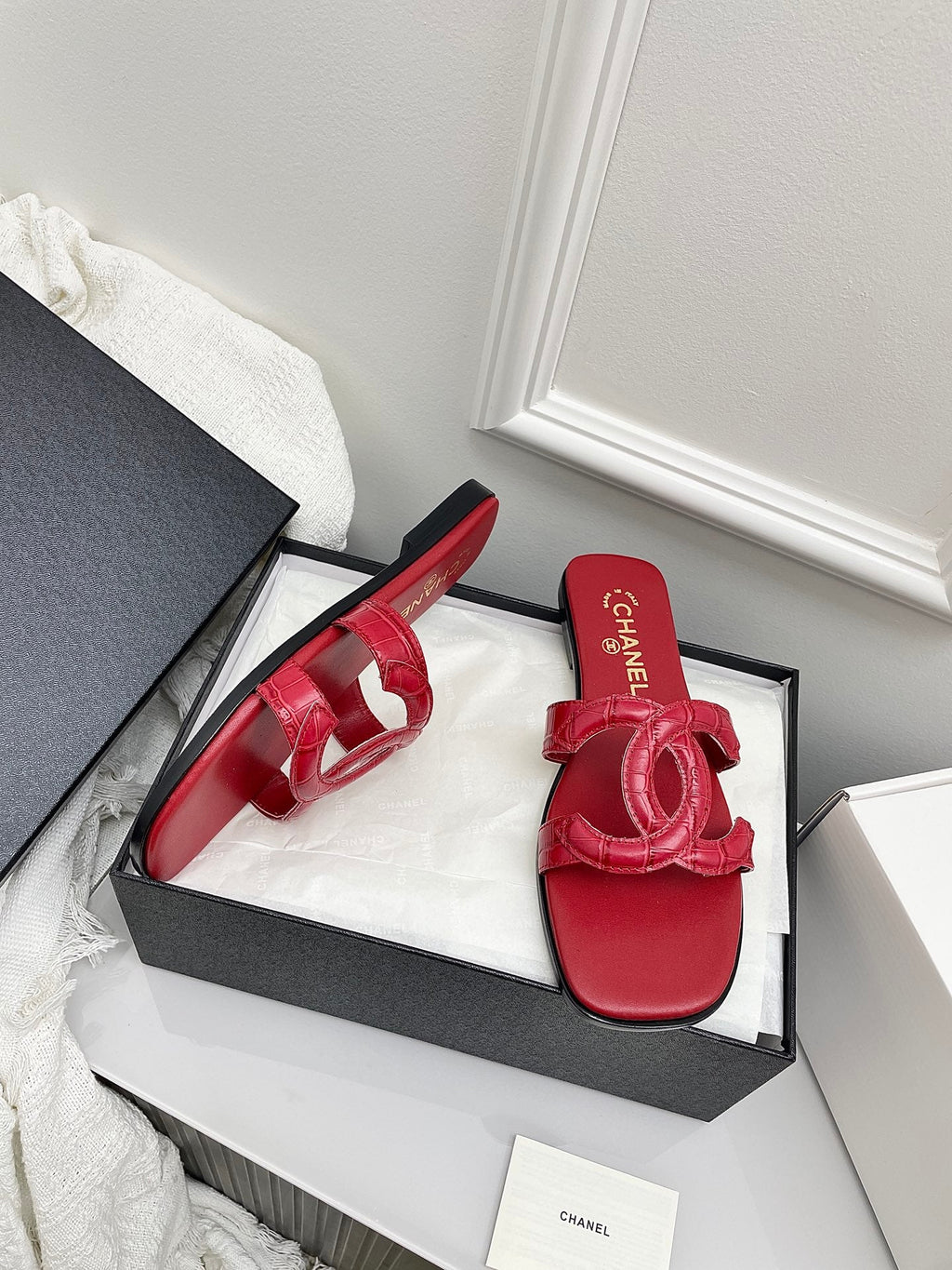CHANEL CC LOGO MULES IN RED CALFSKIN