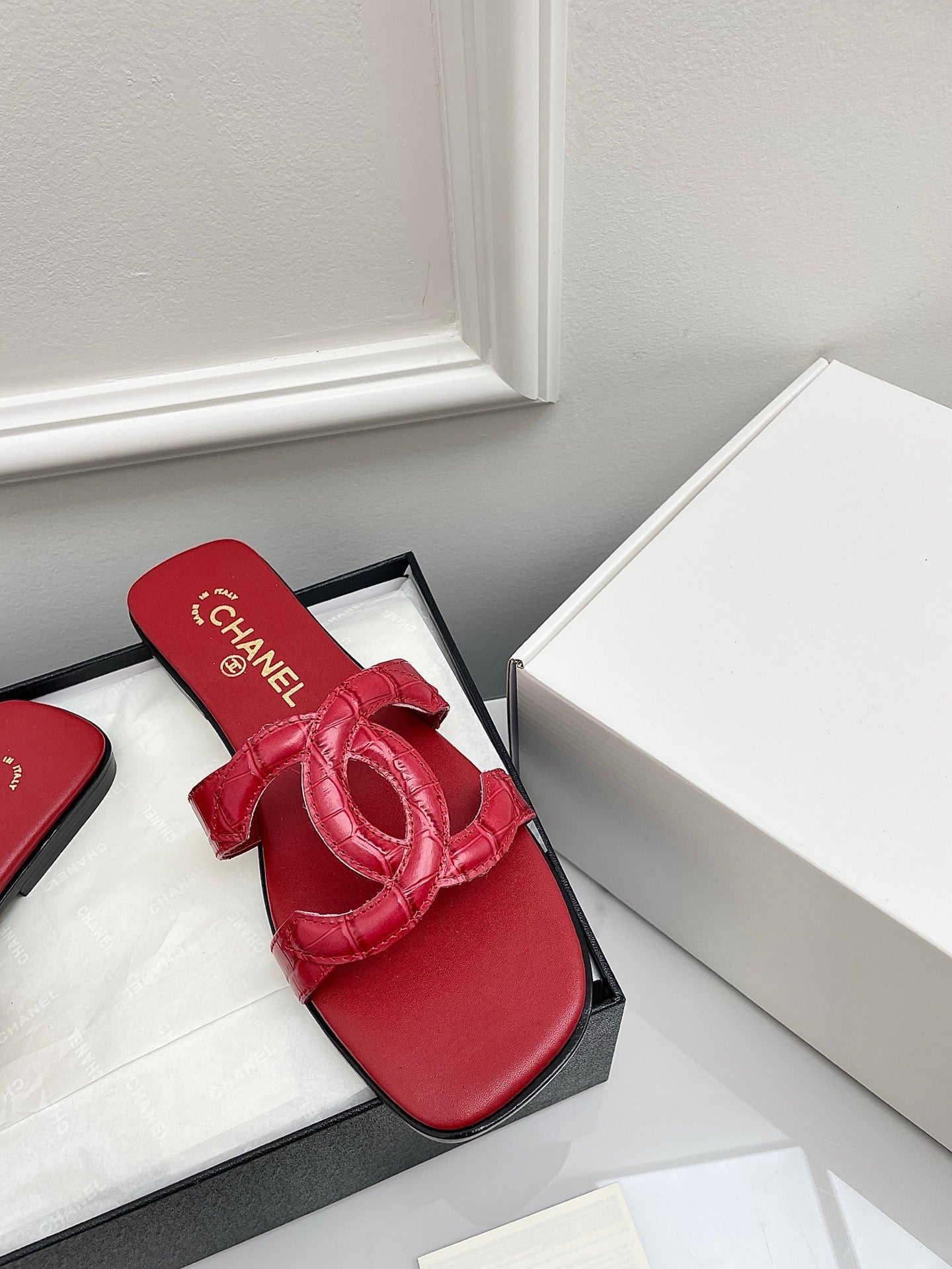 CHANEL CC LOGO MULES IN RED CALFSKIN