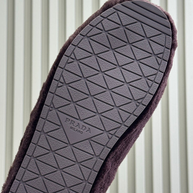 PRADA 25S CLOGS IN WINE RED SHEARLING