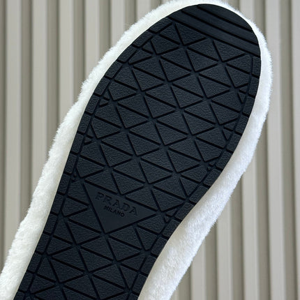 PRADA 25S CLOGS IN WHITE SHEARLING